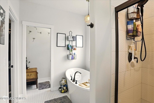8727 Turlock Dr, Eagle River, AK 99577 - full bathroom featuring tile patterned flooring, a freestanding bath, baseboards, and a shower stall