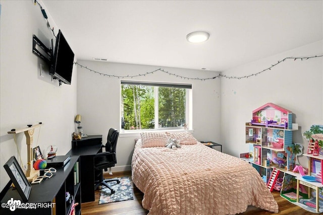8727 Turlock Dr, Eagle River, AK 99577 - bedroom with wood finished floors and a desk