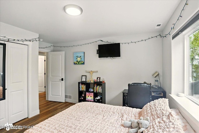 8727 Turlock Dr, Eagle River, AK 99577 - bedroom featuring wood finished floors