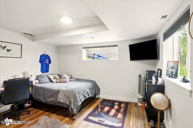 8727 Turlock Dr, Eagle River, AK 99577 - bedroom featuring wood finished floors and baseboards