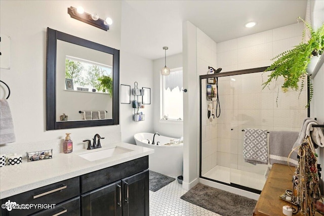 8727 Turlock Dr, Eagle River, AK 99577 - bathroom with a freestanding tub, vanity, a stall shower, and tile patterned floors