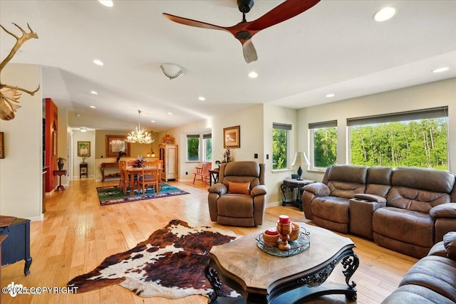 3872 N Charley Dr, Wasilla, AK 99654 - living area with healthy amount of natural light, recessed lighting, light wood finished floors, a chandelier, and a ceiling fan