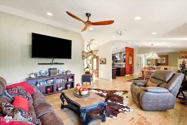3872 N Charley Dr, Wasilla, AK 99654 - living area with a ceiling fan, light wood-type flooring, recessed lighting, a chandelier, and lofted ceiling