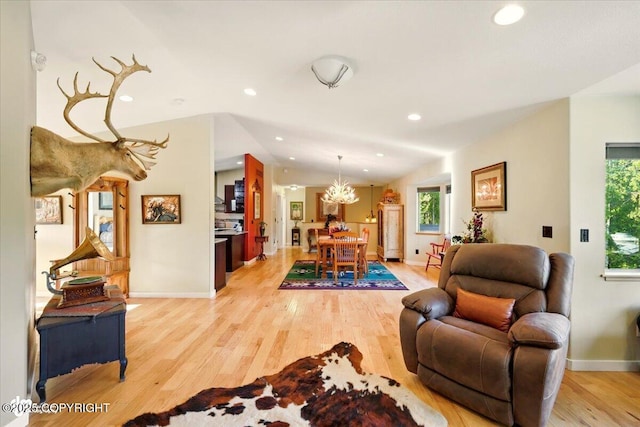 3872 N Charley Dr, Wasilla, AK 99654 - dining room featuring light wood-style flooring, healthy amount of natural light, recessed lighting, baseboards, and a chandelier