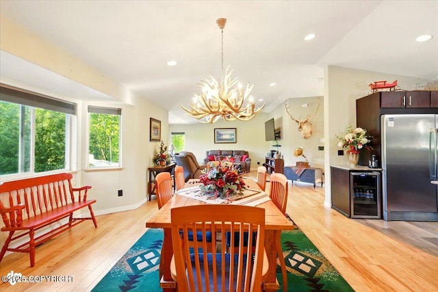 3872 N Charley Dr, Wasilla, AK 99654 - dining room featuring wine cooler, a chandelier, light wood finished floors, recessed lighting, and baseboards