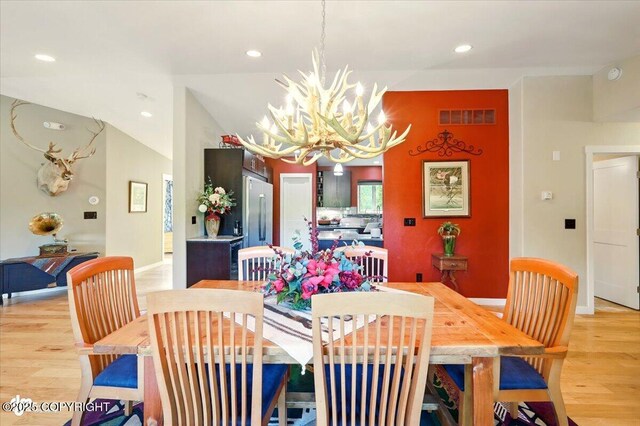 3872 N Charley Dr, Wasilla, AK 99654 - dining room featuring a chandelier, light wood-type flooring, recessed lighting, and baseboards