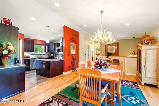 3872 N Charley Dr, Wasilla, AK 99654 - dining room with light wood-type flooring, a chandelier, recessed lighting, and baseboards