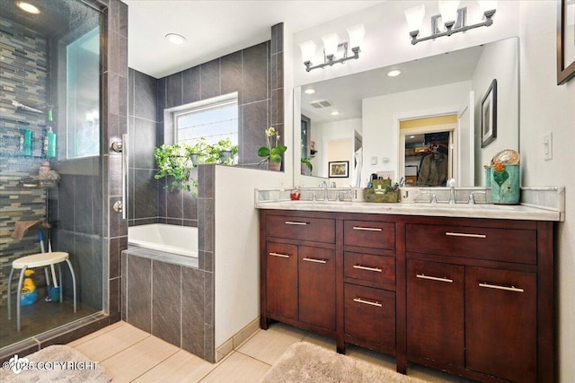 3872 N Charley Dr, Wasilla, AK 99654 - full bath featuring double vanity, a bath, tile patterned floors, and a tile shower
