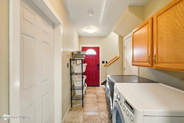 3872 N Charley Dr, Wasilla, AK 99654 - laundry room featuring washing machine and clothes dryer, cabinet space, baseboards, and light tile patterned floors