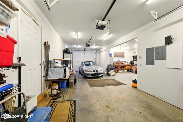 3872 N Charley Dr, Wasilla, AK 99654 - garage featuring electric panel and a garage door opener