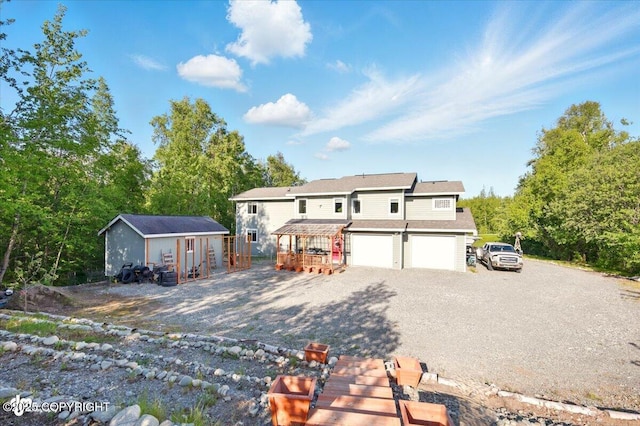 3872 N Charley Dr, Wasilla, AK 99654 - view of front of house with driveway and a garage