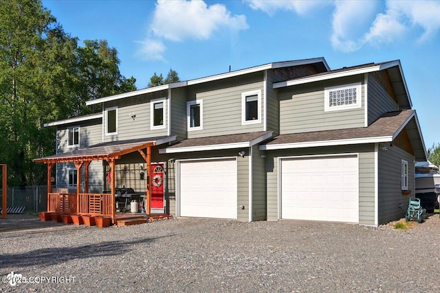 3872 N Charley Dr, Wasilla, AK 99654 - view of front of house featuring a garage, gravel driveway, and roof with shingles