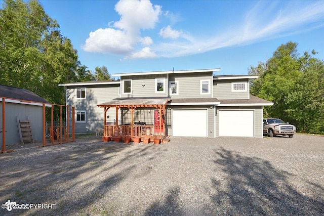 3872 N Charley Dr, Wasilla, AK 99654 - view of front of house with gravel driveway and a garage
