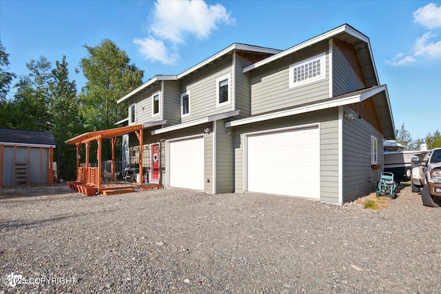 3872 N Charley Dr, Wasilla, AK 99654 - view of front of house featuring gravel driveway and a garage