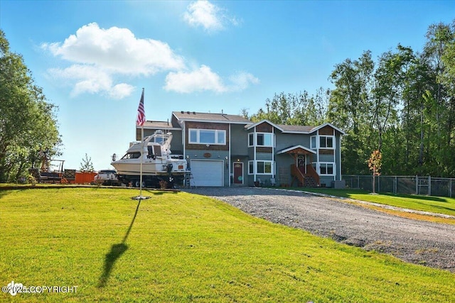 3872 N Charley Dr, Wasilla, AK 99654 - view of front facade with a garage and gravel driveway