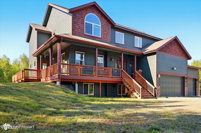 2034 E Sage Rd, Wasilla, AK 99654 - view of front of property featuring covered porch, a front yard, a garage, stairs, and roof with shingles