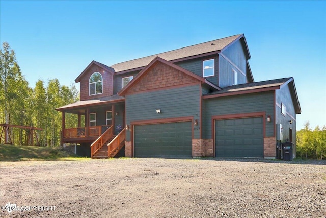 2034 E Sage Rd, Wasilla, AK 99654 - view of front of home featuring covered porch, driveway, and an attached garage