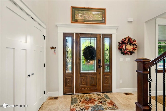 2034 E Sage Rd, Wasilla, AK 99654 - foyer with baseboards, healthy amount of natural light, and stairs