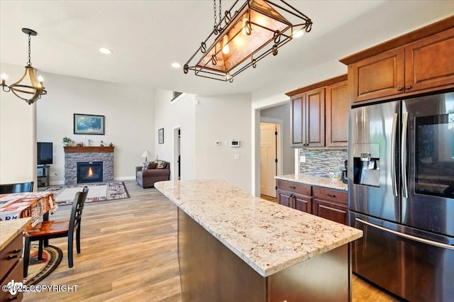 2034 E Sage Rd, Wasilla, AK 99654 - kitchen featuring stainless steel refrigerator with ice dispenser, a chandelier, a kitchen island, recessed lighting, and open floor plan