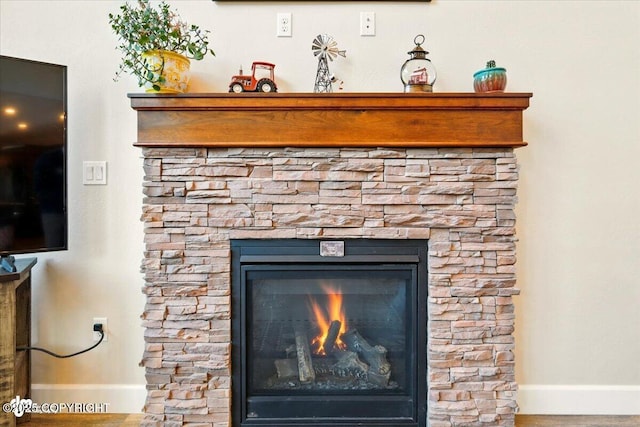 2034 E Sage Rd, Wasilla, AK 99654 - detailed view of baseboards and a stone fireplace