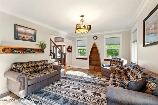 2034 E Sage Rd, Wasilla, AK 99654 - living area with baseboards, wood finished floors, stairs, and crown molding