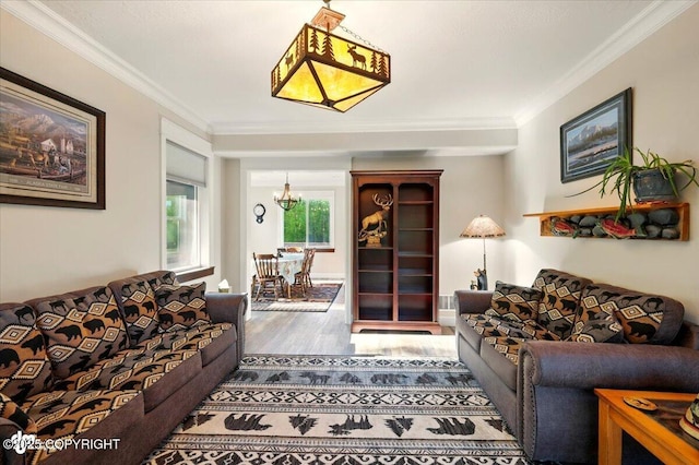 2034 E Sage Rd, Wasilla, AK 99654 - living area with crown molding, wood finished floors, and a chandelier