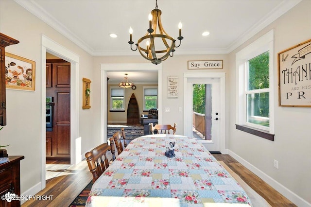 2034 E Sage Rd, Wasilla, AK 99654 - dining area featuring a chandelier, healthy amount of natural light, dark wood-style floors, crown molding, and recessed lighting