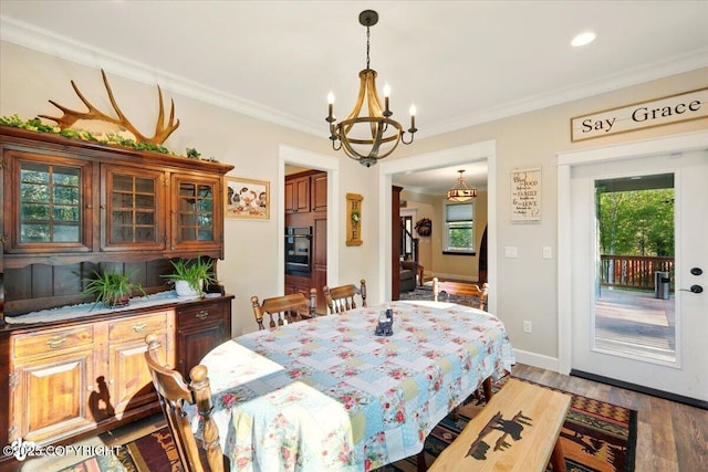 2034 E Sage Rd, Wasilla, AK 99654 - dining space with a chandelier, plenty of natural light, light wood-type flooring, ornamental molding, and baseboards