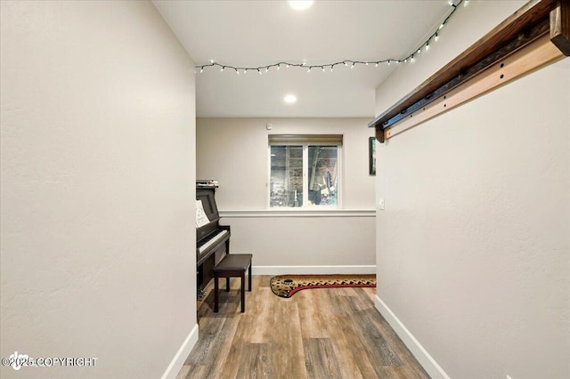 2034 E Sage Rd, Wasilla, AK 99654 - hallway featuring baseboards, wood finished floors, and recessed lighting