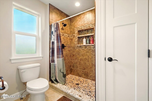 2034 E Sage Rd, Wasilla, AK 99654 - bathroom with baseboards, a stall shower, toilet, plenty of natural light, and recessed lighting