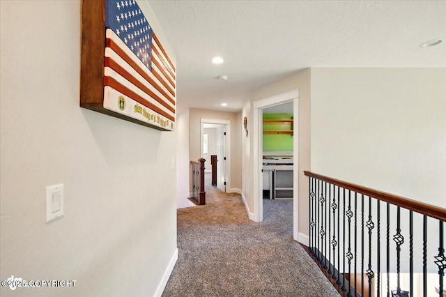 2034 E Sage Rd, Wasilla, AK 99654 - hallway featuring carpet flooring, an upstairs landing, baseboards, and recessed lighting