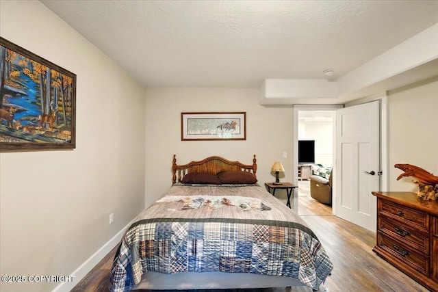 2034 E Sage Rd, Wasilla, AK 99654 - bedroom with wood finished floors