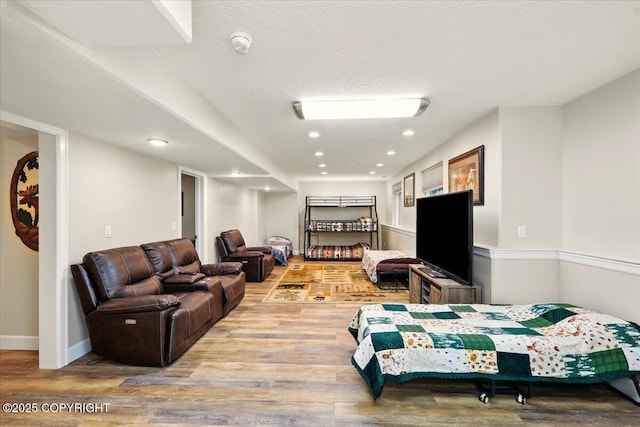 2034 E Sage Rd, Wasilla, AK 99654 - living room featuring wood finished floors, recessed lighting, and baseboards