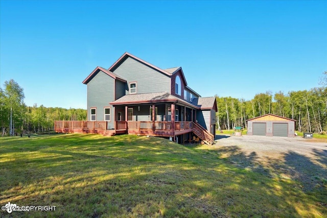 2034 E Sage Rd, Wasilla, AK 99654 - back of house featuring an outdoor structure, a yard, covered porch, and a detached garage