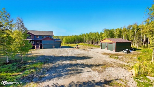 2034 E Sage Rd, Wasilla, AK 99654 - view of dirt / gravel road with a forest view