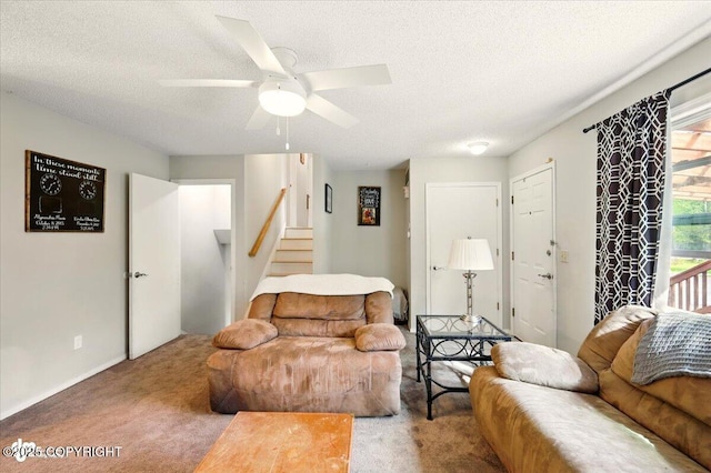 751 W Crestwood Ave, Wasilla, AK 99654 - carpeted living room with stairway, a textured ceiling, and ceiling fan