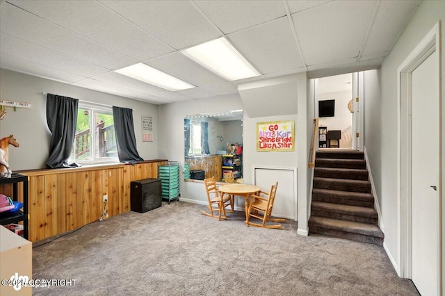 751 W Crestwood Ave, Wasilla, AK 99654 - miscellaneous room with carpet flooring, healthy amount of natural light, stairs, and a drop ceiling