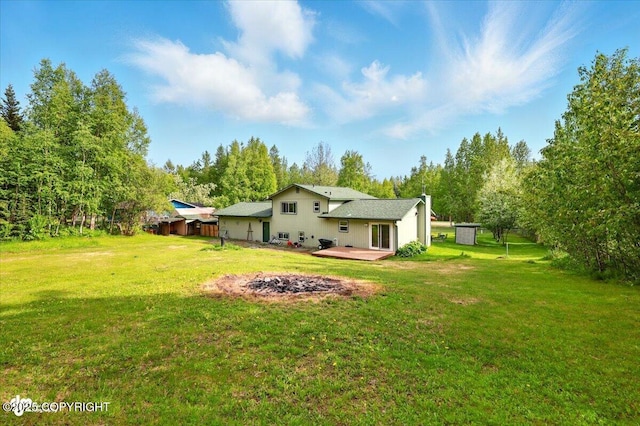751 W Crestwood Ave, Wasilla, AK 99654 - view of grassy yard with view of wooded area