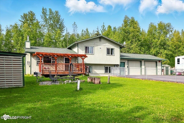 751 W Crestwood Ave, Wasilla, AK 99654 - split level home with driveway, an attached garage, a deck, and a chimney