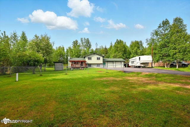 751 W Crestwood Ave, Wasilla, AK 99654 - view of yard featuring driveway and view of scattered trees