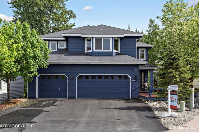 2931 Captain Cook Estates Cir, Anchorage, AK 99517 - view of front of home featuring an attached garage, driveway, and roof with shingles