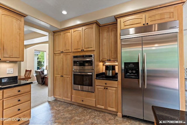 2931 Captain Cook Estates Cir, Anchorage, AK 99517 - kitchen featuring stainless steel appliances, arched walkways, light brown cabinets, recessed lighting, and baseboards