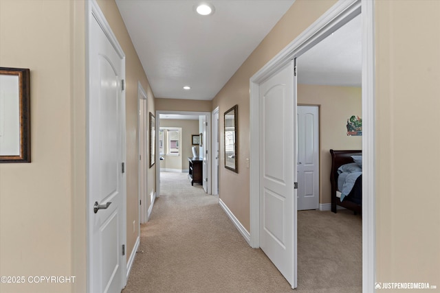 2931 Captain Cook Estates Cir, Anchorage, AK 99517 - corridor featuring light carpet, recessed lighting, and baseboards