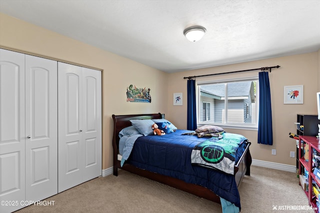 2931 Captain Cook Estates Cir, Anchorage, AK 99517 - bedroom featuring light colored carpet, a closet, and baseboards