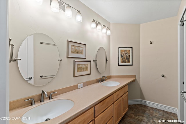 2931 Captain Cook Estates Cir, Anchorage, AK 99517 - bathroom featuring double vanity and baseboards