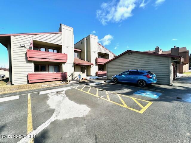 10250 Jamestown Dr # B-09, Anchorage, AK 99507 - view of property featuring uncovered parking