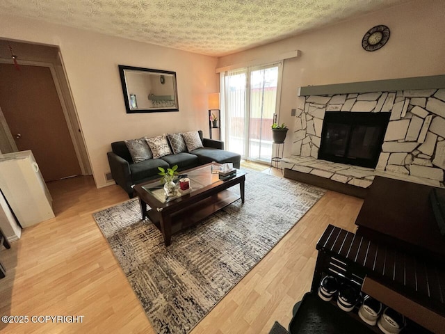 10250 Jamestown Dr # B-09, Anchorage, AK 99507 - living room featuring wood finished floors and a textured ceiling