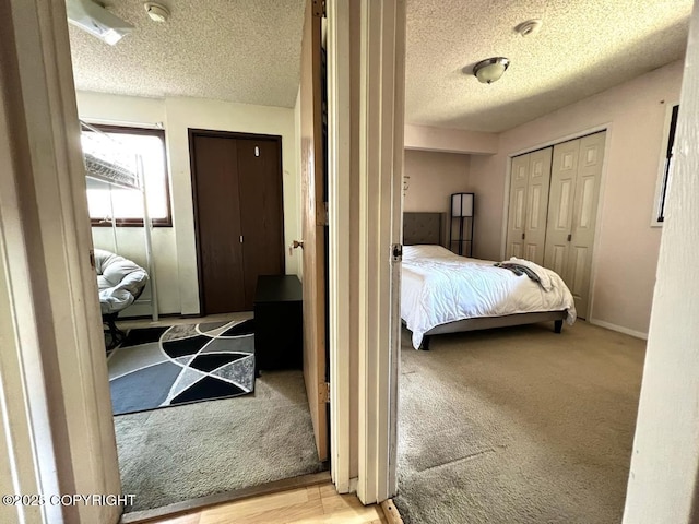 10250 Jamestown Dr # B-09, Anchorage, AK 99507 - carpeted bedroom featuring a textured ceiling and baseboards