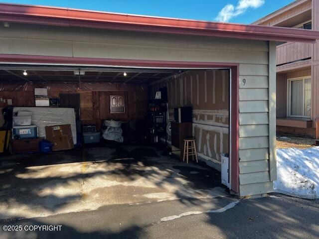 10250 Jamestown Dr # B-09, Anchorage, AK 99507 - garage featuring driveway