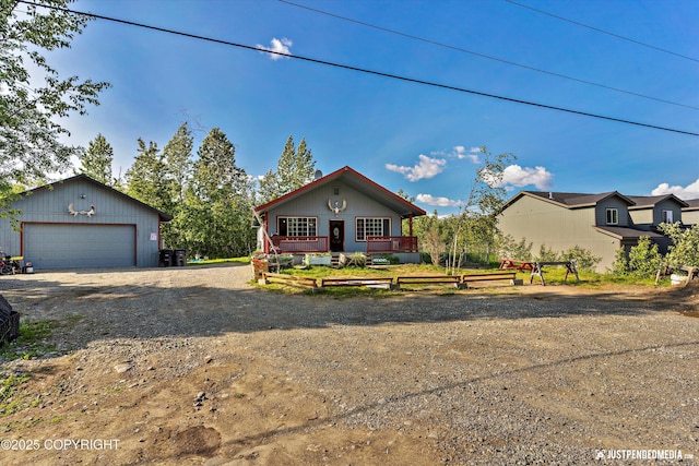 2261 Ridgewood Dr, Wasilla, AK 99654 - view of front of property with an outdoor structure, driveway, and a detached garage